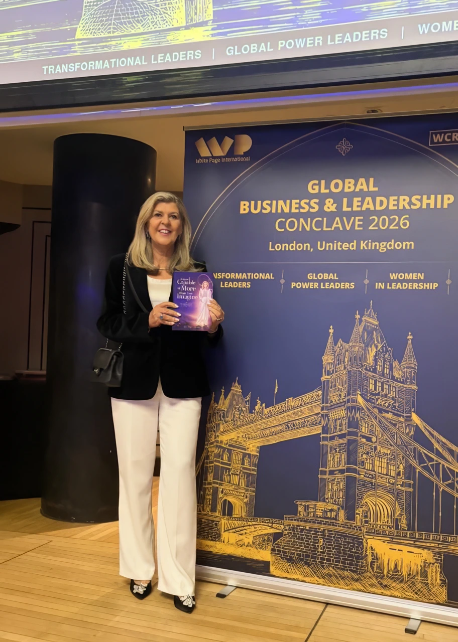Dr Tanya Hames holding her book “You Are Capable of More Than You Imagine” at the Global Business & Leadership Conclave 2026 in London.